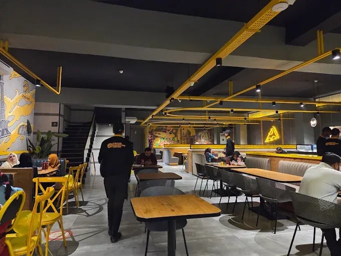 Interior view of Cheezious restaurant